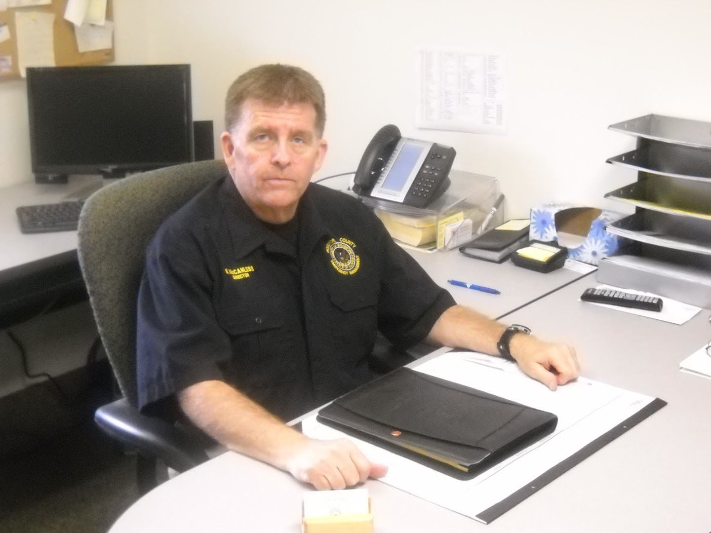 Kent McCanless sitting at desk